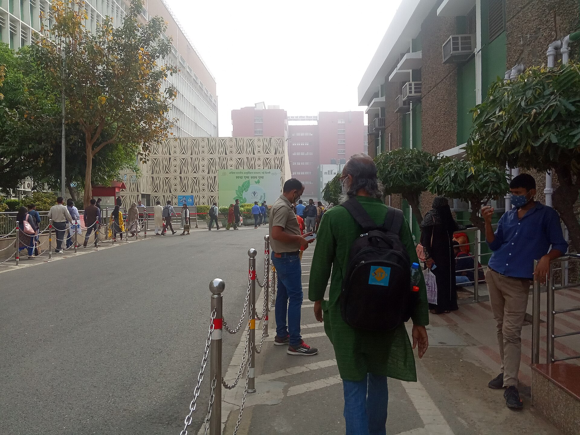 AIIMS Delhi | Indian Press People walk near buildings at the All India Institute of Medical Science in Delhi, highlighting diaspora professionals and.