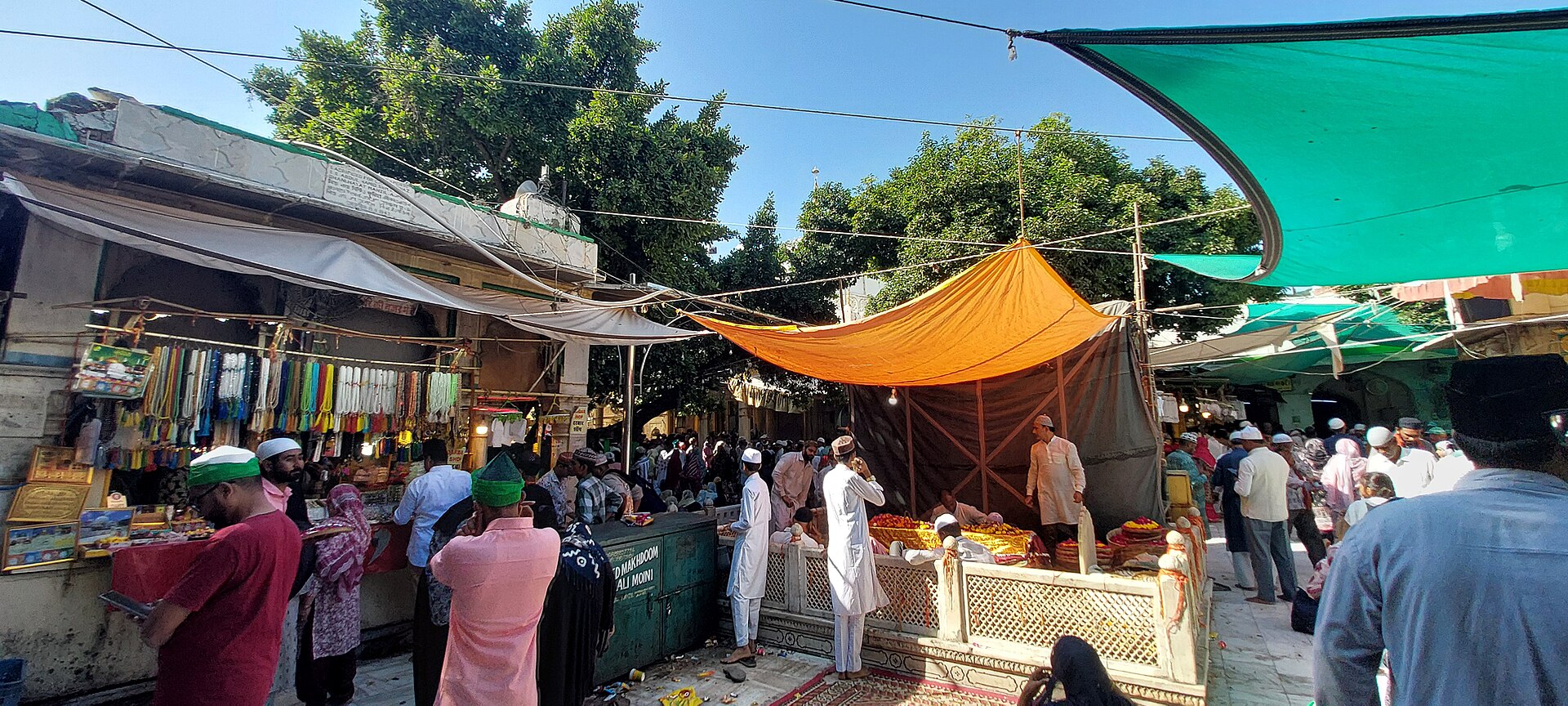 Ajmer Sharif | Indian Press A crowded outdoor market scene at Ajmer Sharif shows religious pluralism in India.