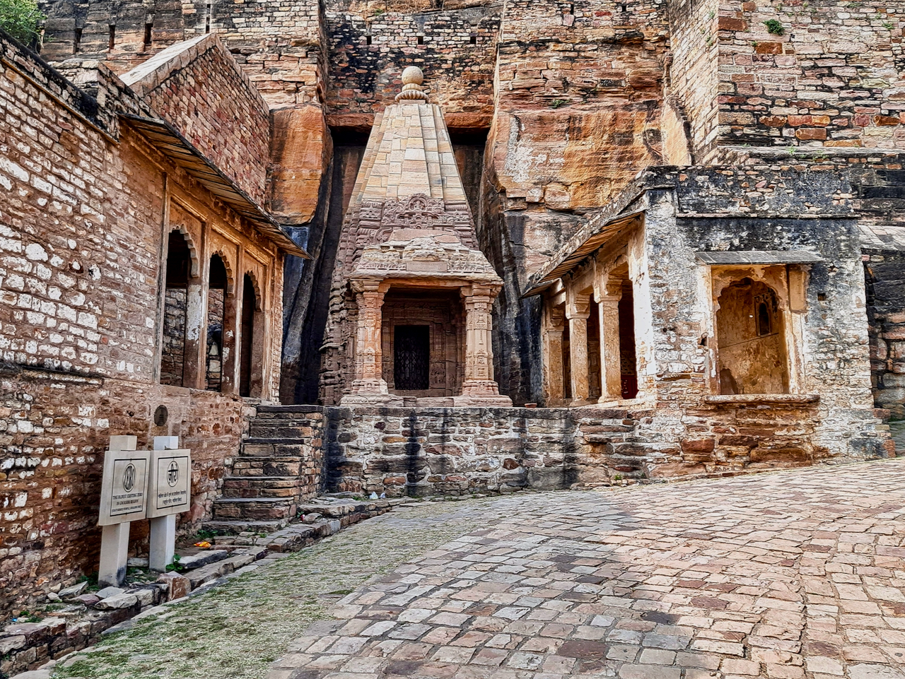 Chaturbhuj Temple | Indian Press Ancient temple architecture is carved into a sandstone cliff face in India, showcasing the country's rich history.