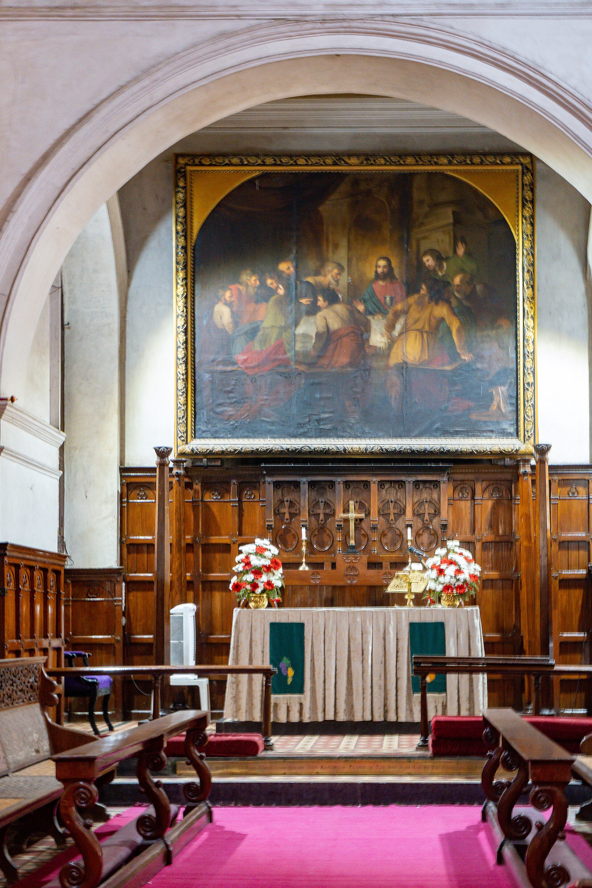 Colonial Trade Companies | Indian Press A church altar with a painting and flowers illustrates the history of colonial trade in India.