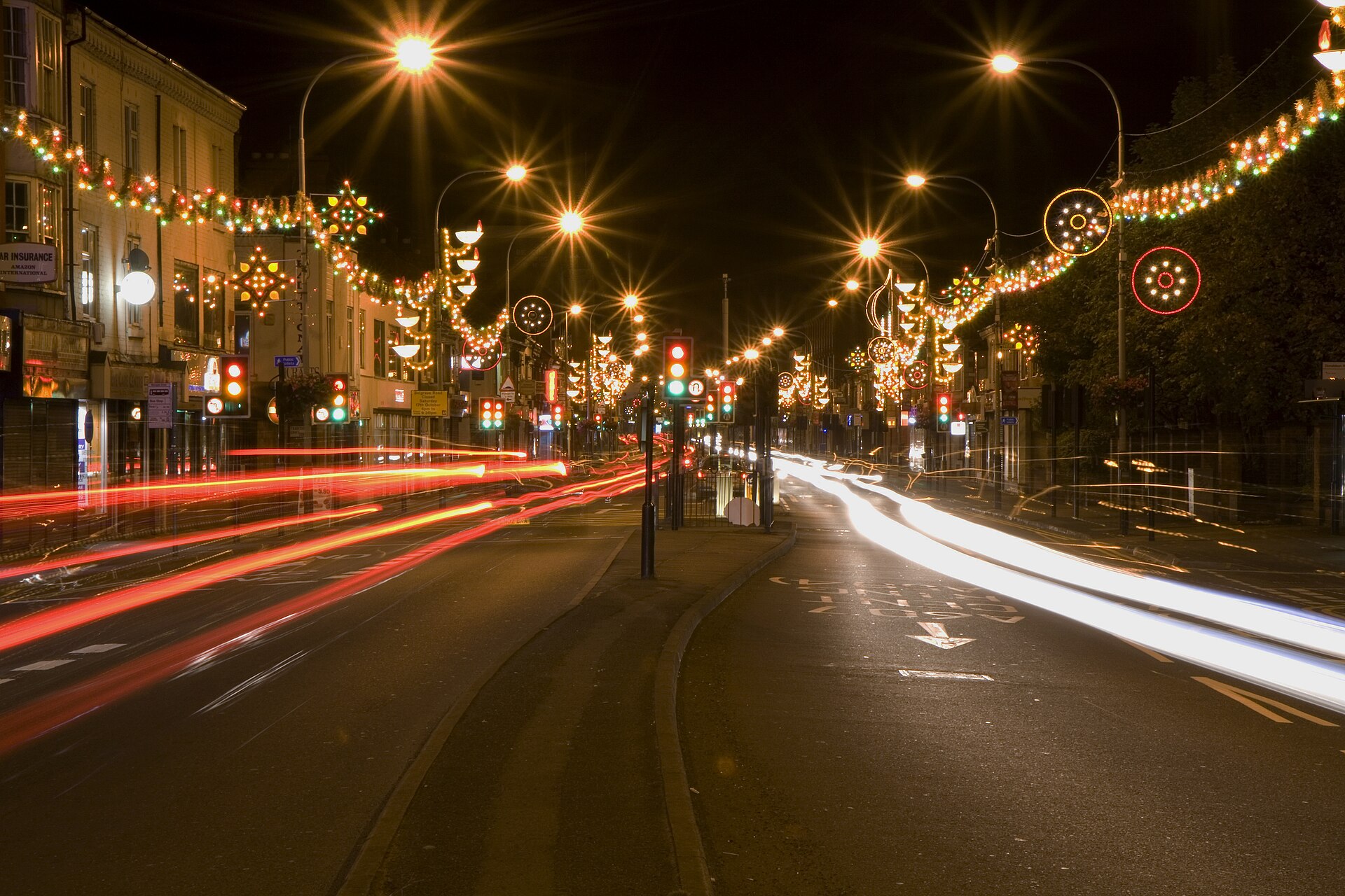 A nighttime street scene shows festive Diwali lighting in Leicester, England.