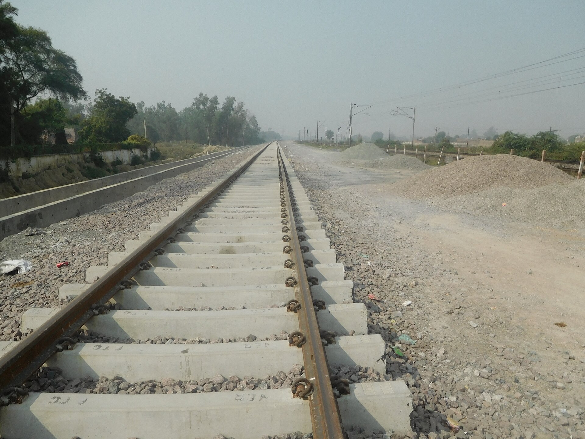 Eastern Dedicated Freight Corridor | Indian Press Railroad tracks and a construction site show India's infrastructure development as part of the Eastern Dedicated Freight.