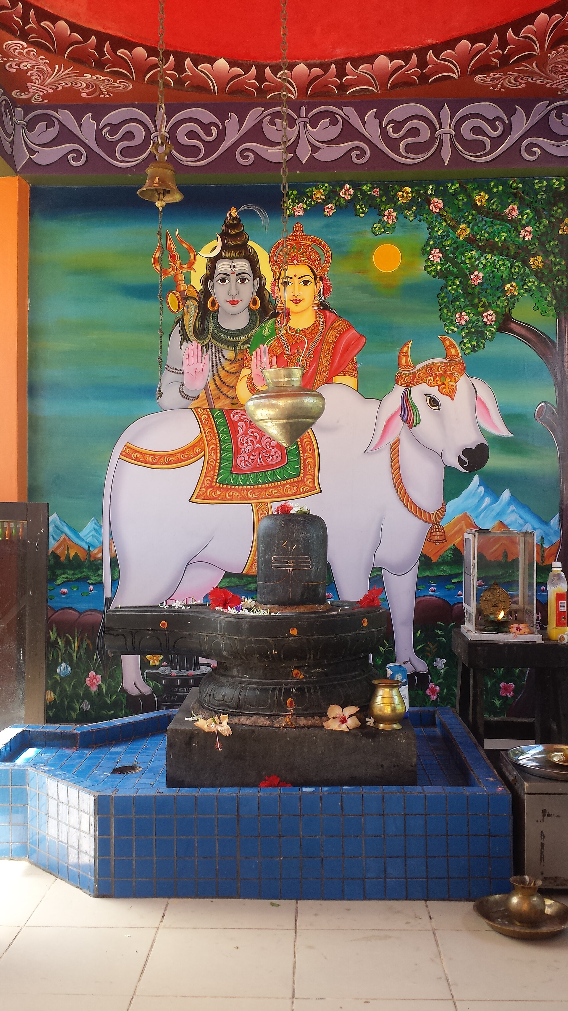 A Hindu shrine depicts Shiva and Parvati riding Nandi the bull, representing Fiji's Indian culture.