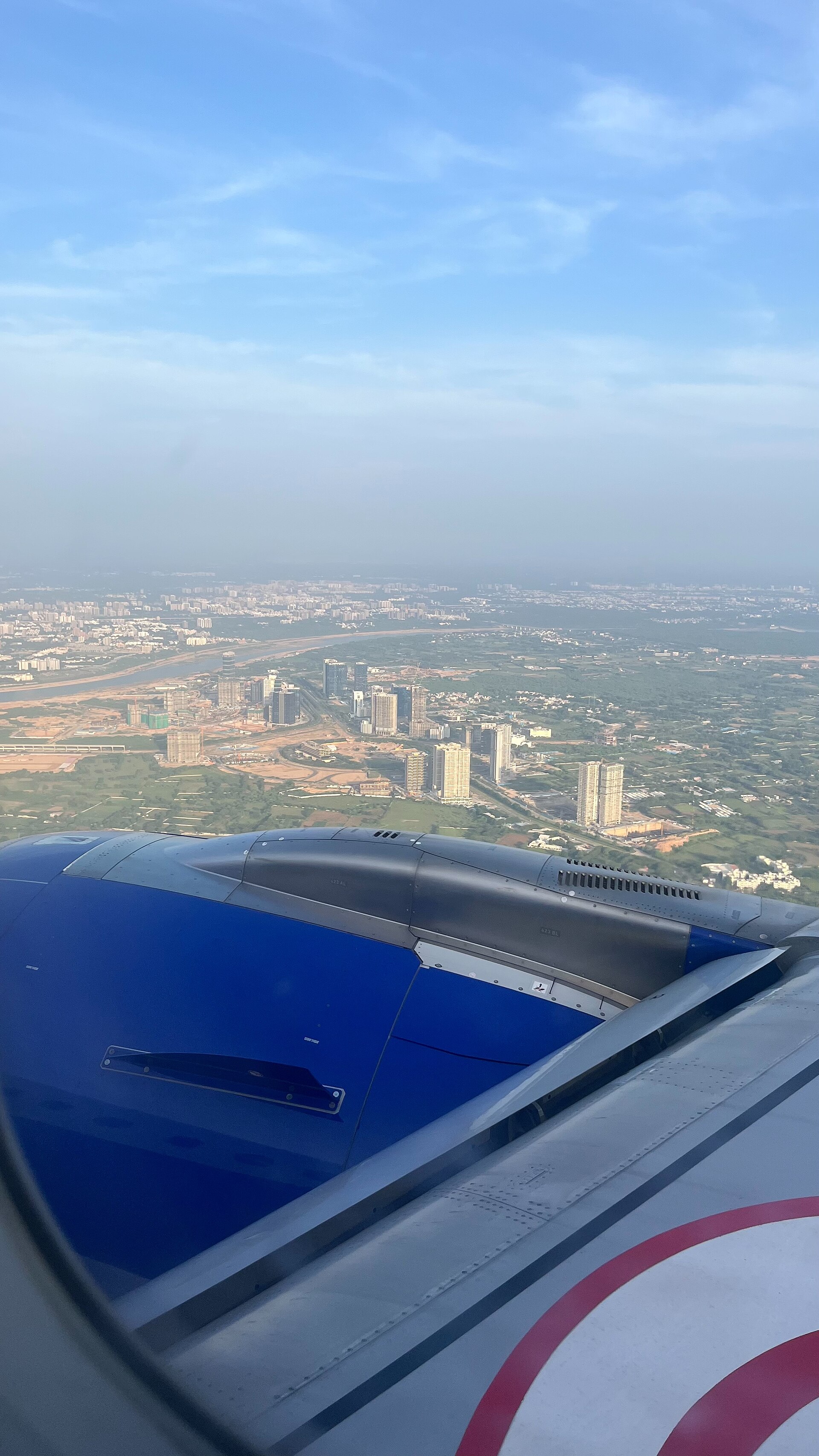 GIFT City | Indian Press An aerial view of GIFT City in Gandhinagar, India is seen from an airplane window while discussing Indian stock exchanges.