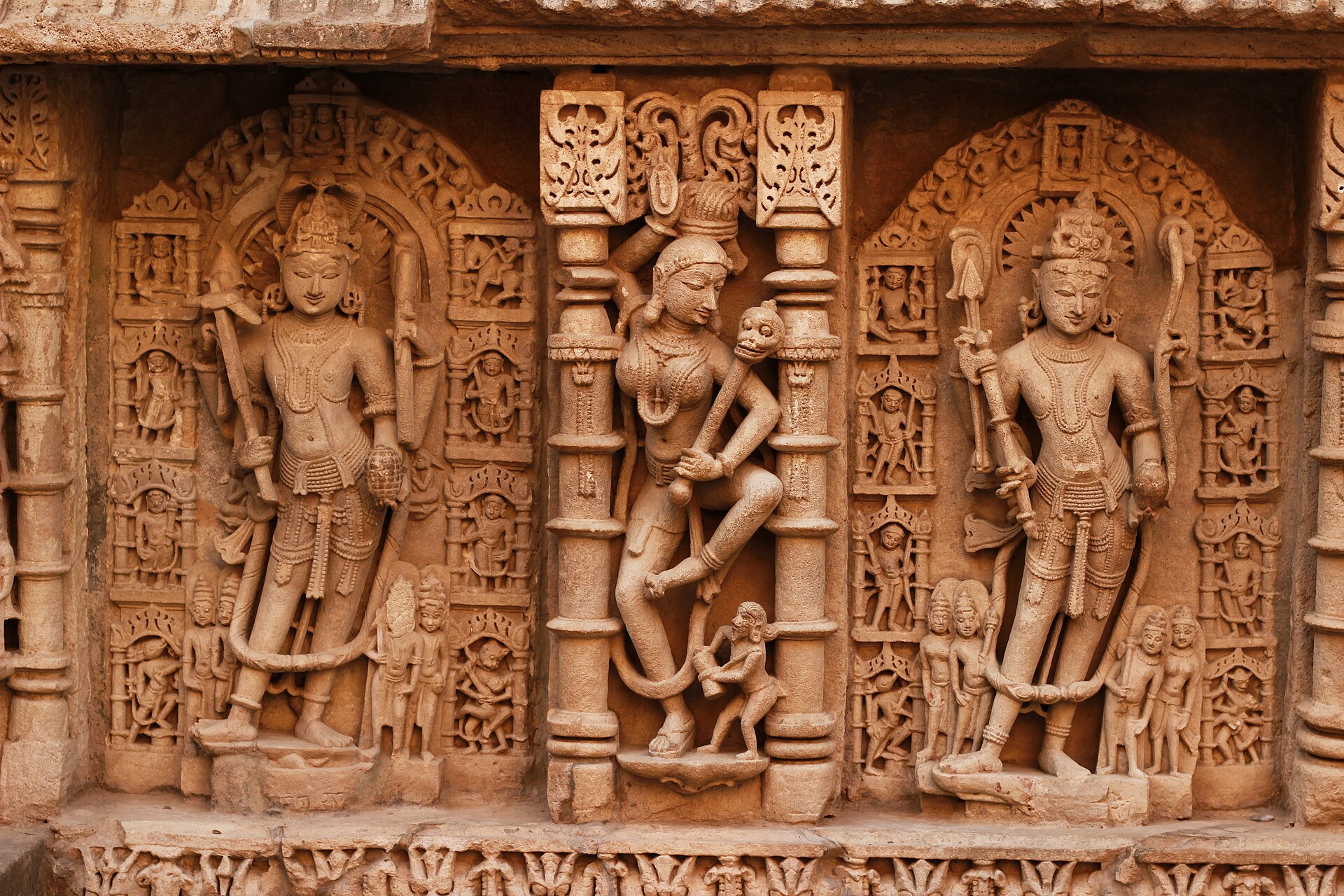 Gujarati Architecture | Indian Press Intricate carvings on a historic temple wall showcase Hindu art and the cultural heritage of Gujarat.