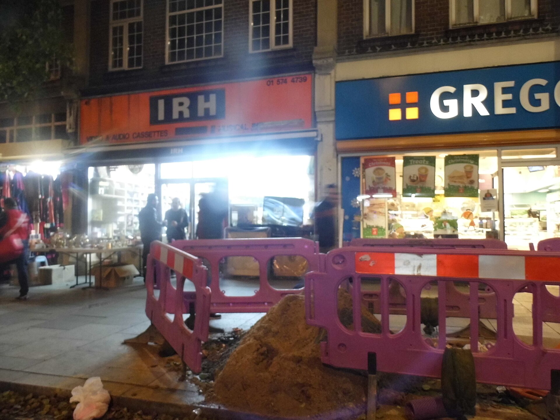 Southall Broadway | Indian Press Construction work blocks a sidewalk near Gregory's Bakery on Southall Broadway, illustrating migration networks.