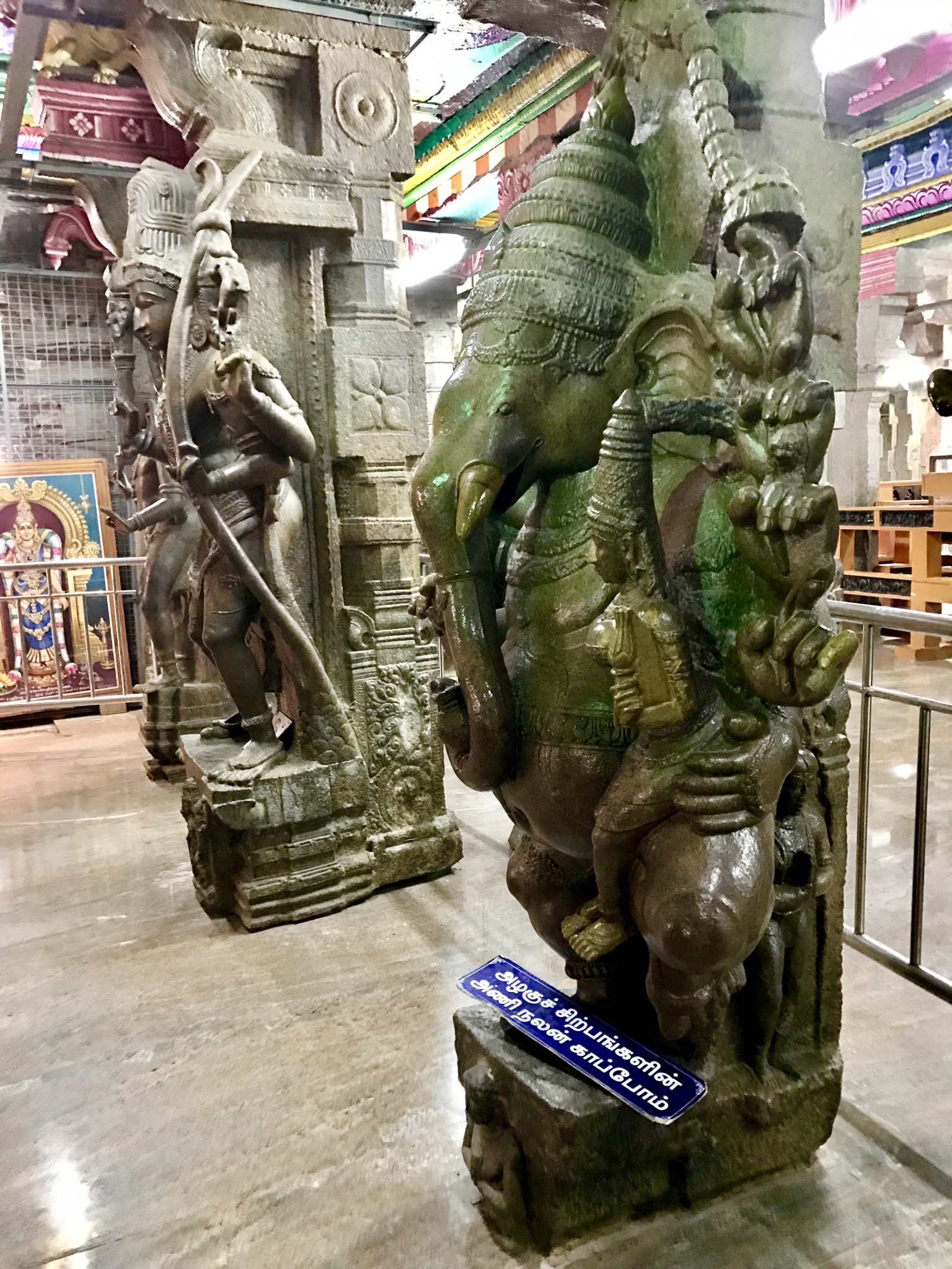 Tamil Language | Indian Press An intricately carved stone pillar with an elephant sculpture inside Madurai Meenakshi Amman Temple showcases beautiful.