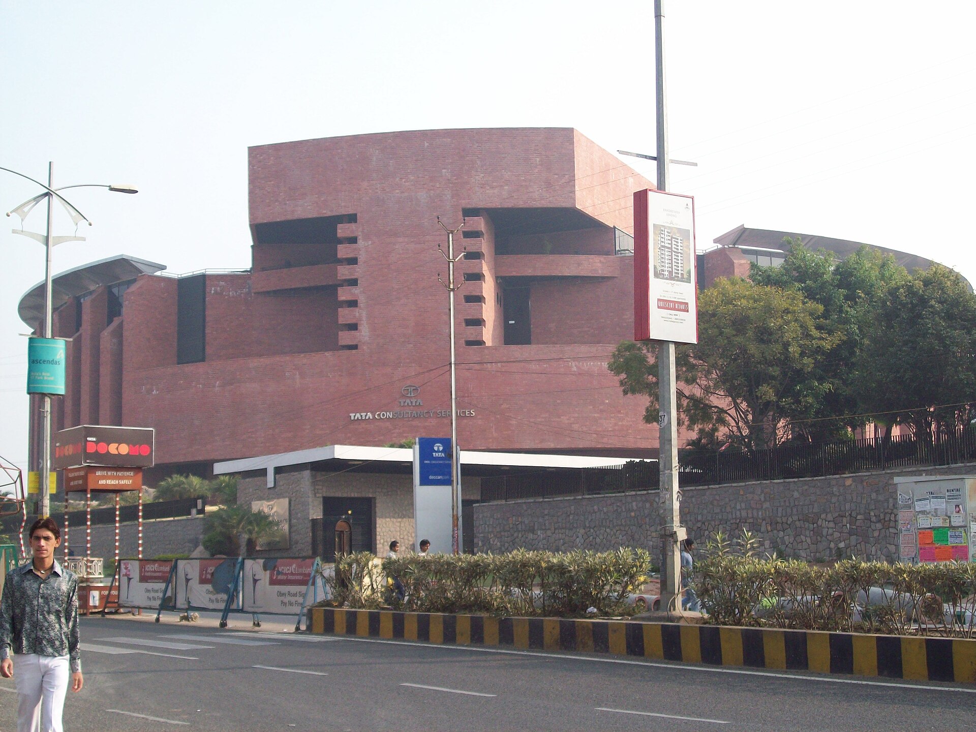 Tata Consultancy Services | Indian Press A modern building belonging to Tata Consultancy Services in Hyderabad, showcasing India's role in outsourcing.