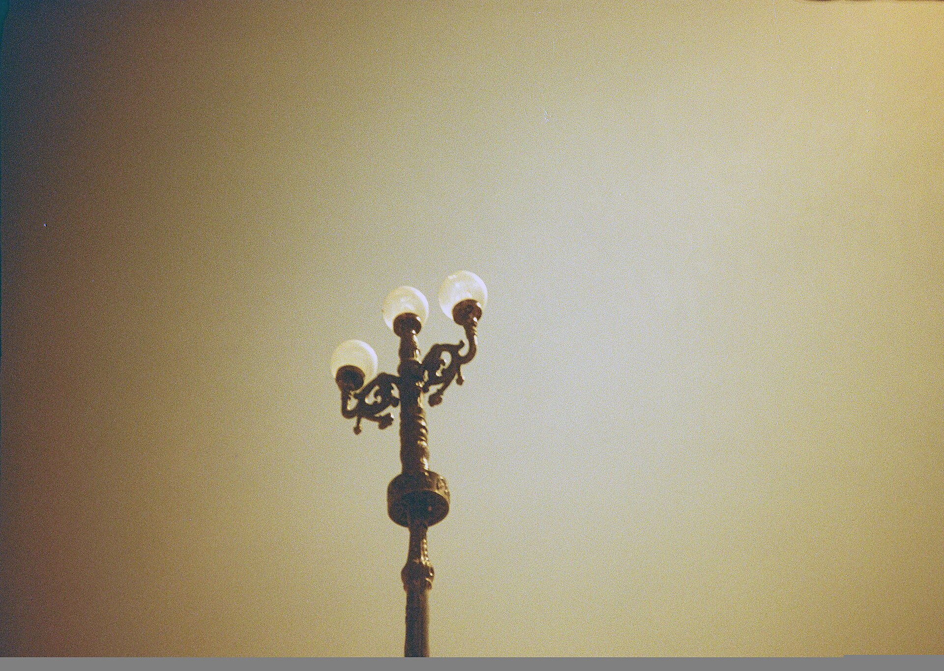 Udaipur Lamppost | Indian Press An ornate lamppost stands against a pale sky during wedding season in Udaipur, India.